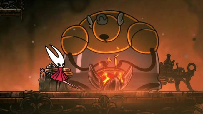 Hornet stands next to Forge Daughter, a large NPC clad in armour, next to her forge in Hollow Knight: Silksong.
