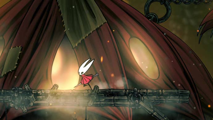 Hornet in Hollow Knight: Silksong enters the home of the Seamstress in the Far Fields.